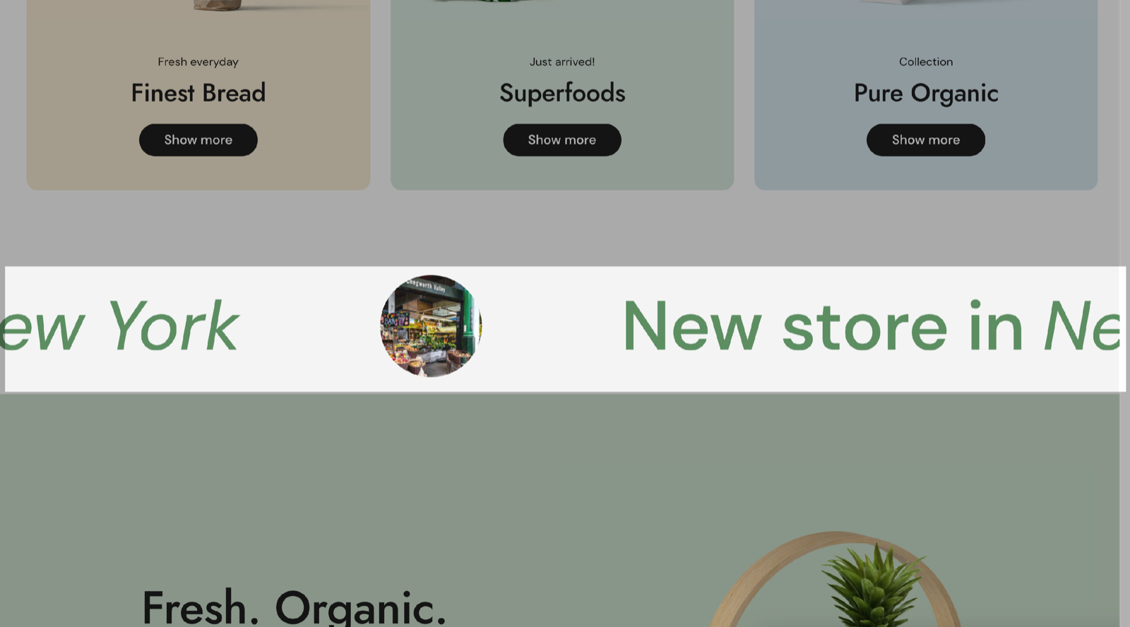 Scrolling text section: a line of green text, New store in New York, scrolling across the page with a round store image between the repeats.