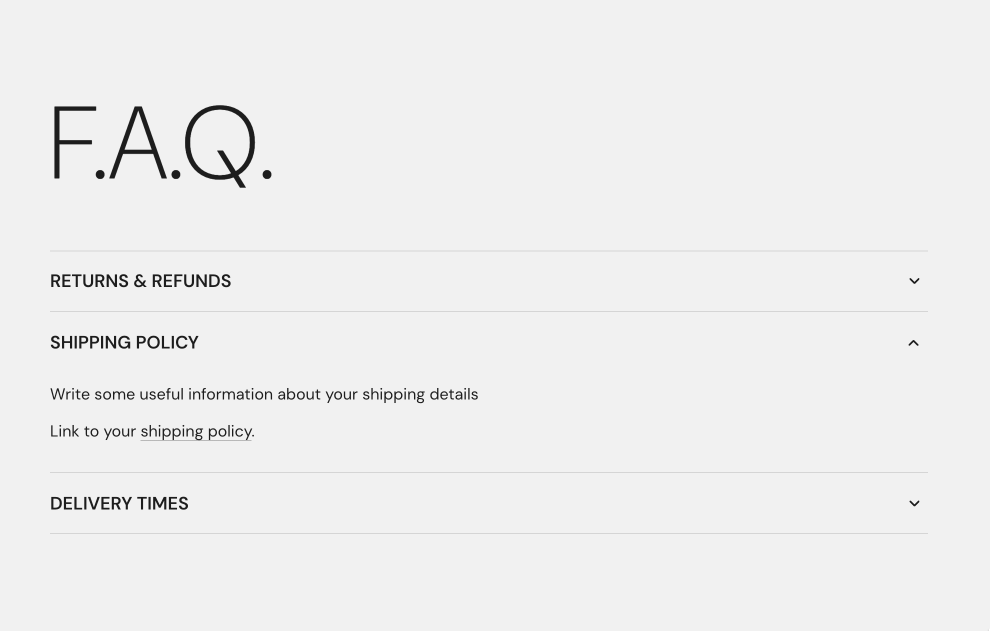 Storefront Accordion block: the heading F.A.Q. above three uppercase accordion rows, with Shipping policy open showing placeholder text and a link.