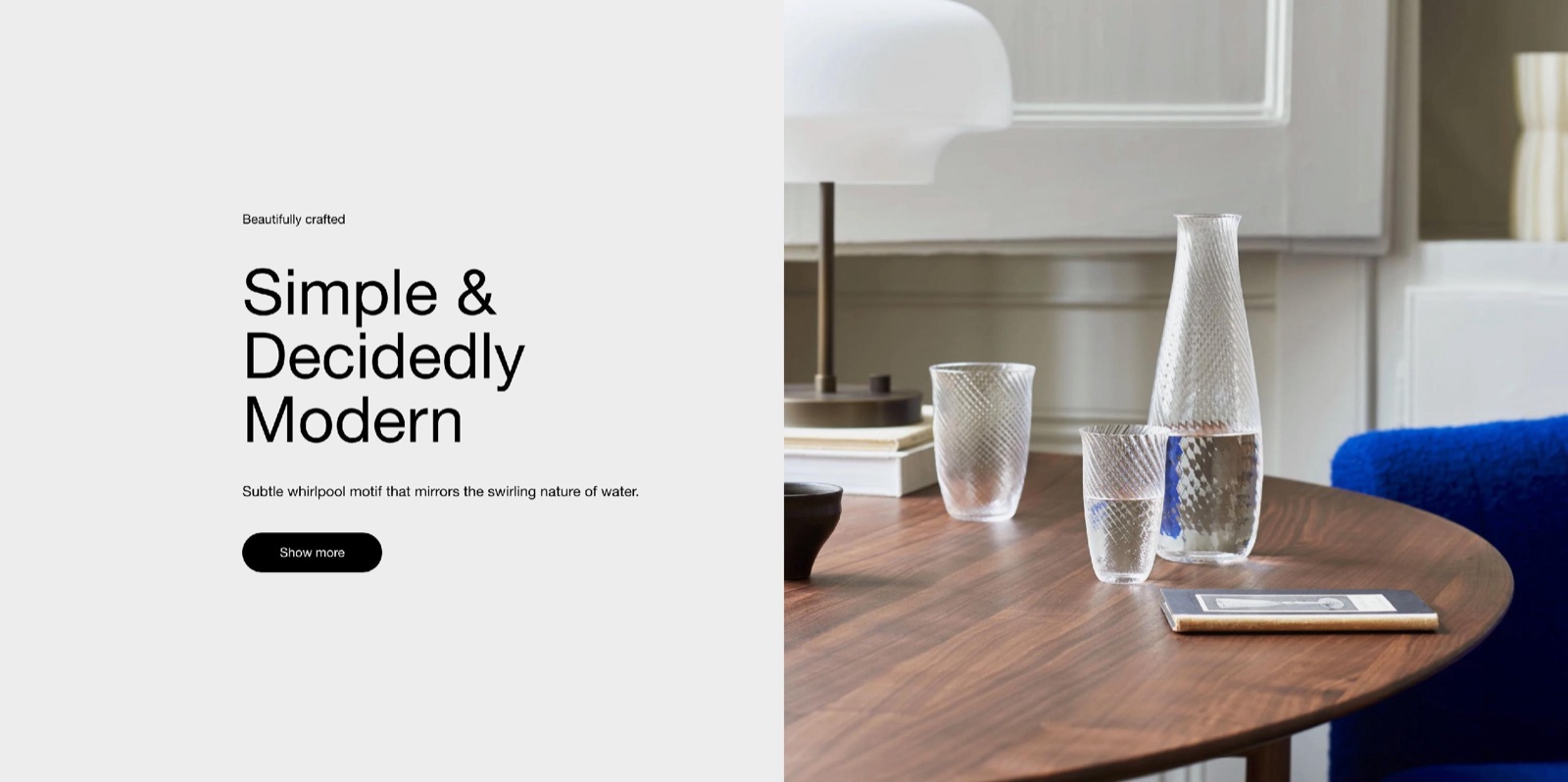 Storefront Rich text section: a grey card with the caption "Beautifully crafted", the heading "Simple & Decidedly Modern", a line of text and a black Show more button, beside a photo of glassware on a wooden table.