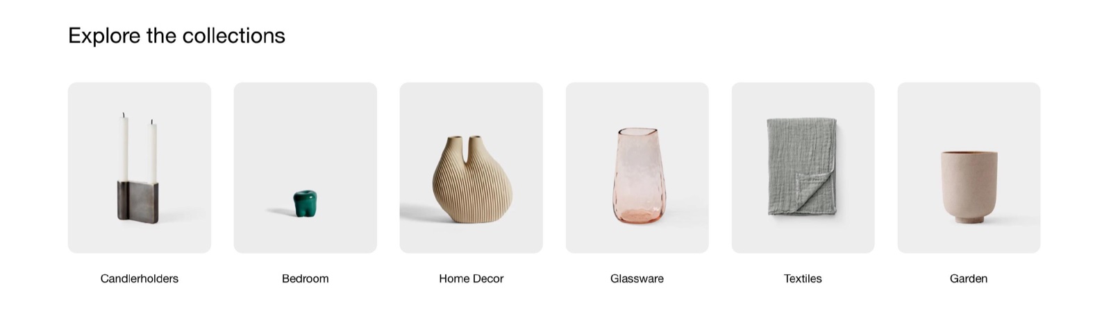 Storefront Collection list section "Explore the collections" with six collection cards: Candlerholders, Bedroom, Home Decor, Glassware, Textiles and Garden.