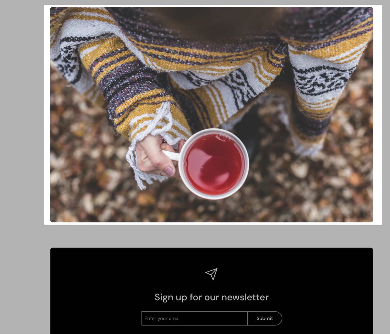 Image section showing a photo of a hand holding a cup of tea uncropped, above an Email signup section.