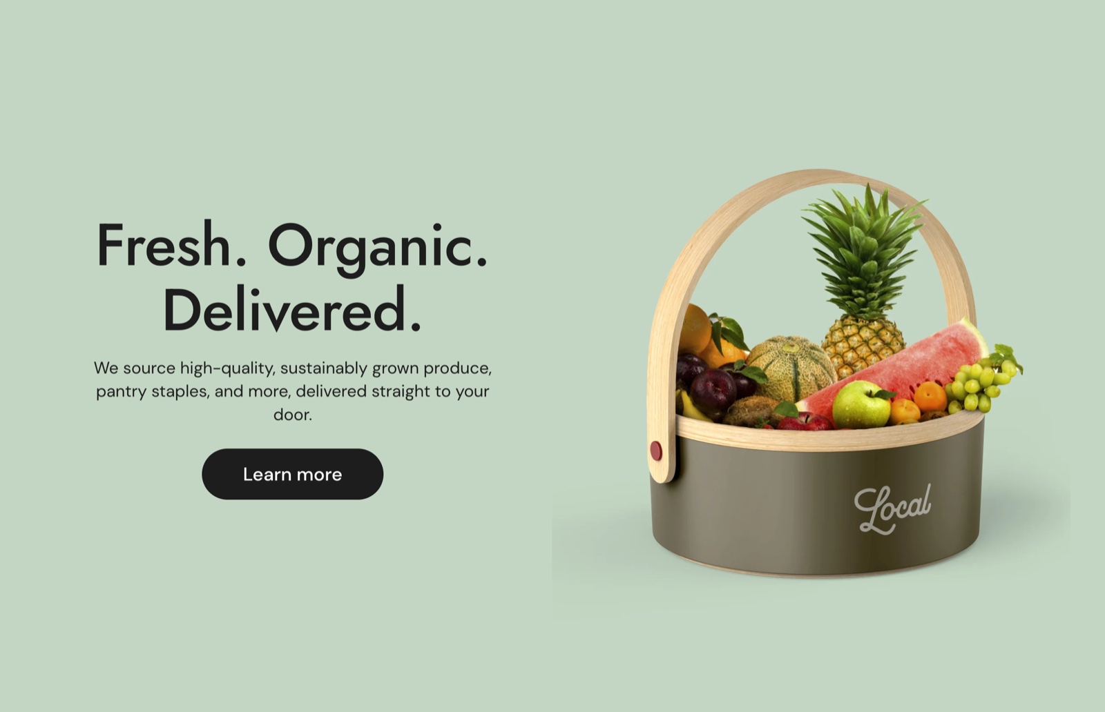 Rich text section on a green background: the heading Fresh. Organic. Delivered., a paragraph and a Learn more button on the left, a fruit basket image on the right.