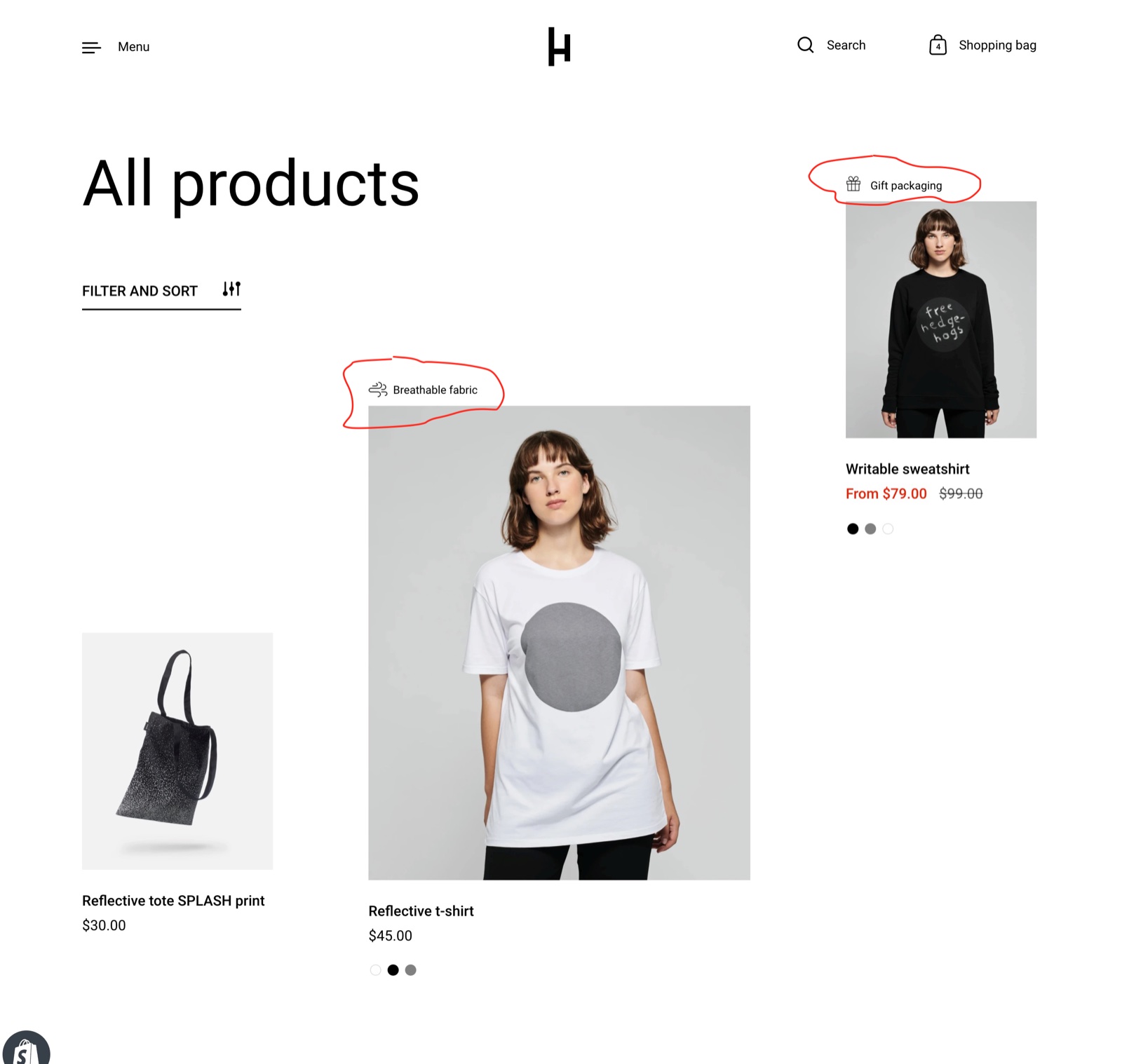 Storefront collection page All products in the asymmetrical layout: two product cards carry unique product badges, an icon with the text Breathable fabric and Gift packaging, circled in red, above the product images.
